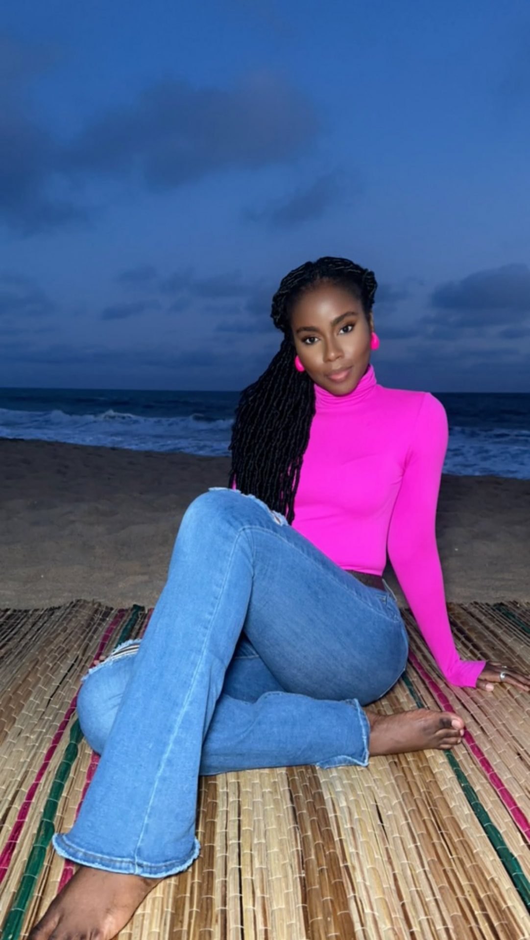 Mz Vee poses at the beach