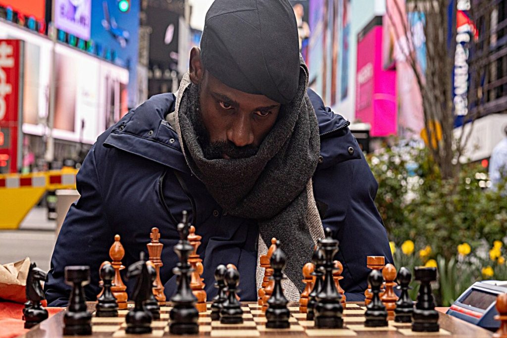 Tunde Onakoya shatters chess marathon record in NYC to support education