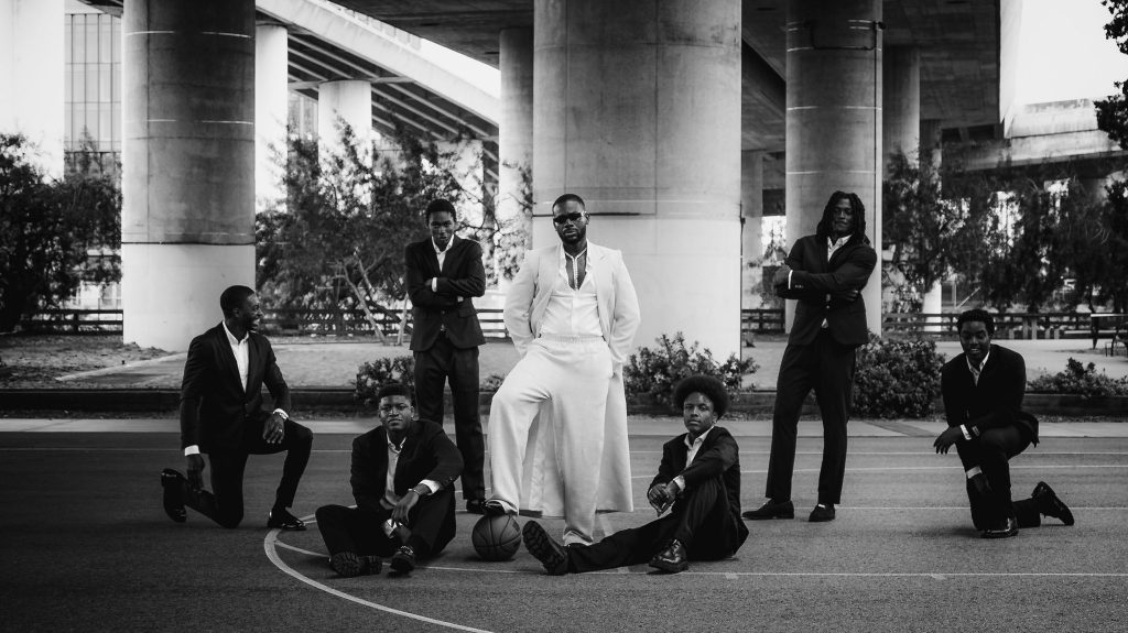 Adekunle Gold in white and black for ‘Coco Money’